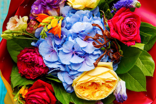 Close-up photo ofp bouquet of multi-colored roses.