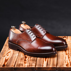leather stylish men's shoes on a black background