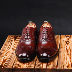 leather stylish men's shoes on a black background
