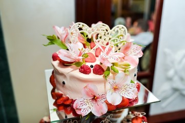 Wedding cake with flowers. Detail of a food banquet