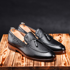 leather stylish men's shoes on a black background