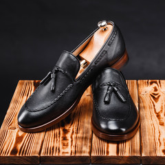 leather stylish men's shoes on a black background