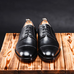 leather stylish men's shoes on a black background