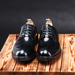 leather stylish men's shoes on a black background