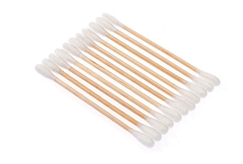 Eco-friendly materials. Wooden, cotton swabs on a white background