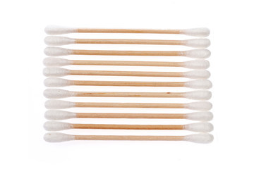 Eco-friendly materials. Wooden, cotton swabs on a white background