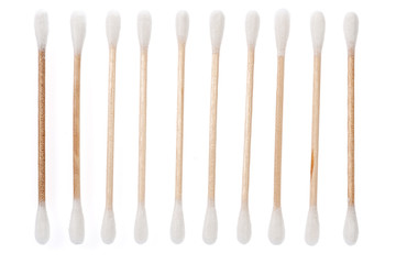 Eco-friendly materials. Wooden, cotton swabs on a white background