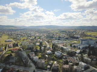 Gorlice, Poland - 3 9 2019: Panorama of a small European medieval city at the present time. View from the drone or quadrocopter on the MOSiR sports complex and the historical center. Landscape Design