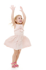 Obraz premium Little girl in a dress developing in the wind.