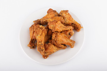 Crispy buffalo chicken wings on a white plate