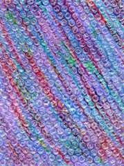 Abstract background with multicolored stripes and bubble wrap.