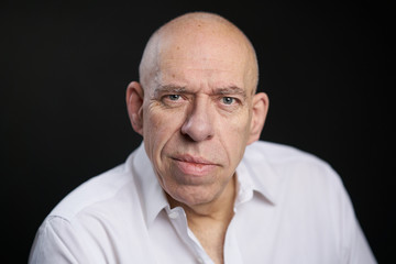 Obraz premium Bald caucasian man with shirt in studio