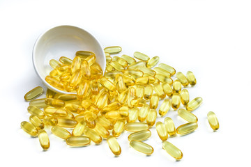 Fish oil capsules in containers. Supplementary food for good health with isolated. Omega 3. Vitamin E. Copy space.