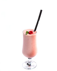 Fruit and berry pink smoothie in a tall glass, decorated with raspberry and mint on an isolated white background