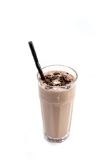 Milk-chocolate cocktail in a tall glass with a straw decorated with chocolate on an isolated white background