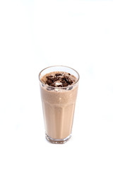 Milk-chocolate cocktail in a tall glass decorated with chocolate on an isolated white background