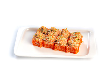 Set sushi rolls on a rectangular white plate on an isolated white background