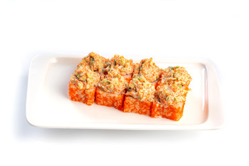 Set sushi rolls on a rectangular white plate on an isolated white background