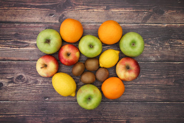 Naklejka na ściany i meble Healthy lifestyle - fruits and vegetables on wooden background