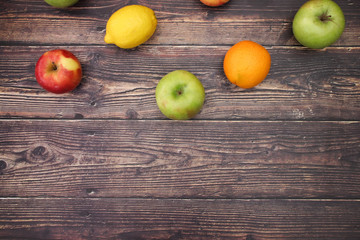 Healthy lifestyle - fruits and vegetables on wooden background