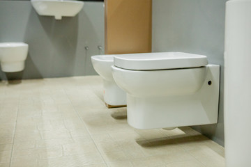 Fototapeta na wymiar blurred image of toilet bowls aisle in a hardware store