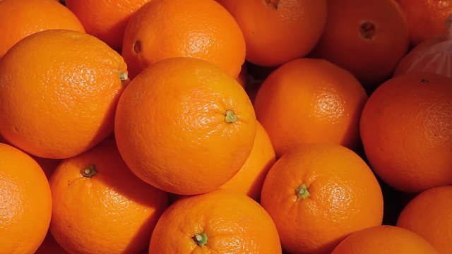 A crop of fresh oranges close up 