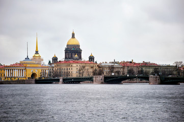 Fototapeta premium View of St. Isaac's Cathedral and Admiralty from Neva river embankment, Saint Petersburg, Russia