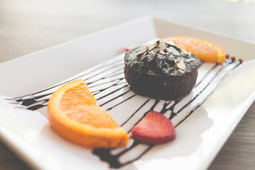 chocolate lava cake with fresh fruit and coffee