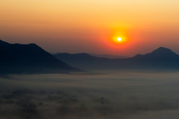 Sunrise with black shadow of mountain in morning