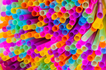 Close up to plenty colorful straws background