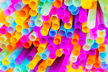 Close up to plenty colorful straws background