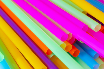 Close up to plenty colorful straws background