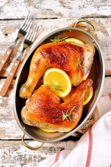 Chicken legs baked with orange slice an