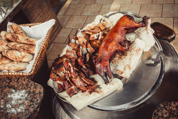 Assorted cutting grilled lamb, rabbit, pork on wooden table with knife. Top view. Hot Meat dishes