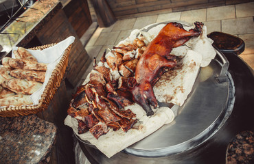 Assorted cutting grilled lamb, rabbit, pork on wooden table with knife. Top view. Hot Meat dishes