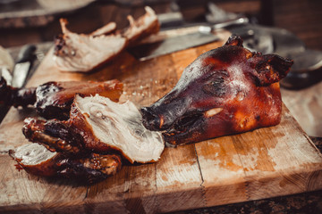 Grilled pig with meat steak on cutting board. Hot Meat © Jukov studio