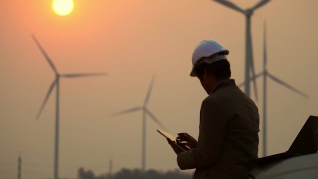 Senior Engineer, Asian are monitoring system wind turbine electricity generation with teblet footage 4K