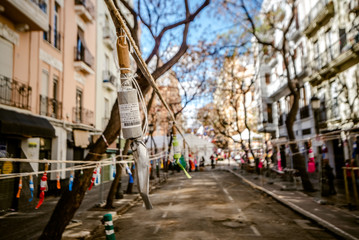 Fototapeta na wymiar Valencia, Spain - March 19, 2019: Aspect of a downtown street where a Mascleta has been set up, full of firecrackers and fireworks, before its launch.