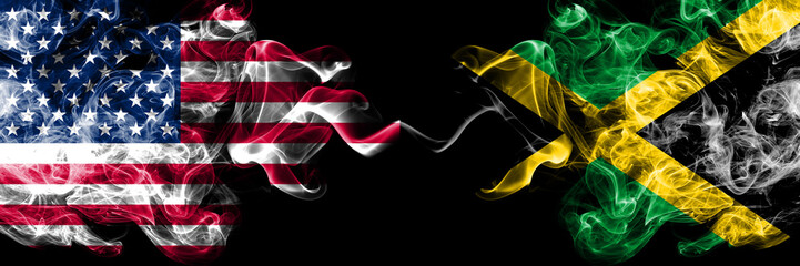 United States of America vs Jamaica, Jamaican smoky mystic flags placed side by side. Thick colored silky smoke flags of America and Jamaica, Jamaican