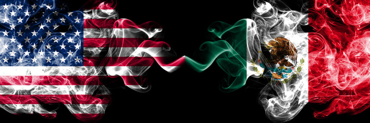 United States of America vs Mexico, Mexican smoky mystic flags placed side by side. Thick colored silky smoke flags of America and Mexico, Mexican