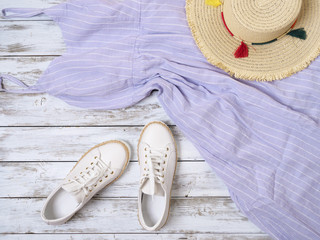 Womens clothing, shoes, accessories (lavender dress, white leather sneakers, straw hat). Fashion outfit, spring summer collection. Shopping concept. Flat lay, view from above