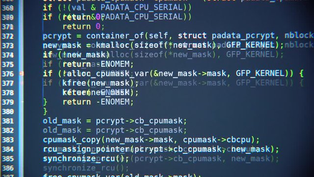 The program code scrolls on the computer screen