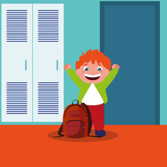little schoolboy with schoolbag in school corridor