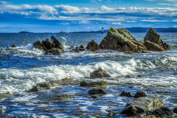 Fototapeta premium Rocky shoreline with crashing waves