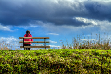 Sitting alone on a bench