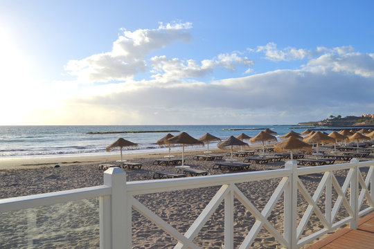 A view of the empty Torviscas Beach in Costa Adeje, Tenerife, Canary Islands, Spain. Seashore background. 