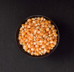 Dried corn kernels on black  background