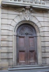 Florence Italy old arched wooden iron doors