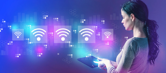 Wifi concept with business woman using a tablet computer