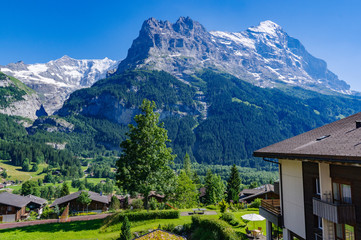 Eiger, Monch and Jungfrau from village in the Grindelwald